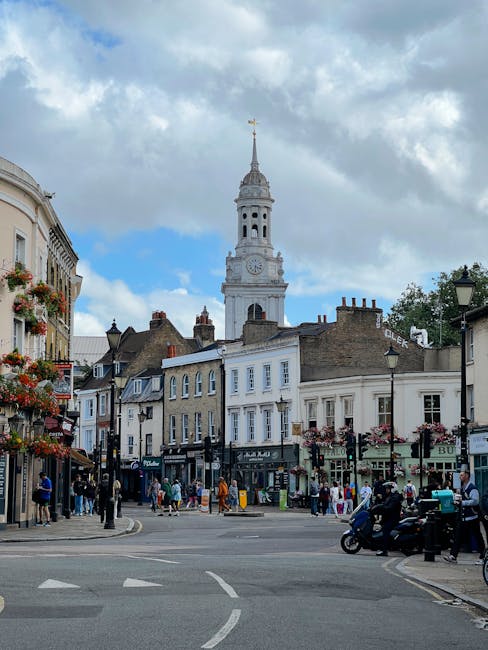 A lively street scene in Becontree Heath featuring a cluster of fresh floral bouquets arranged with vibrant pink and white roses, complemented by greenery and wrapped in elegant transparent cellophane